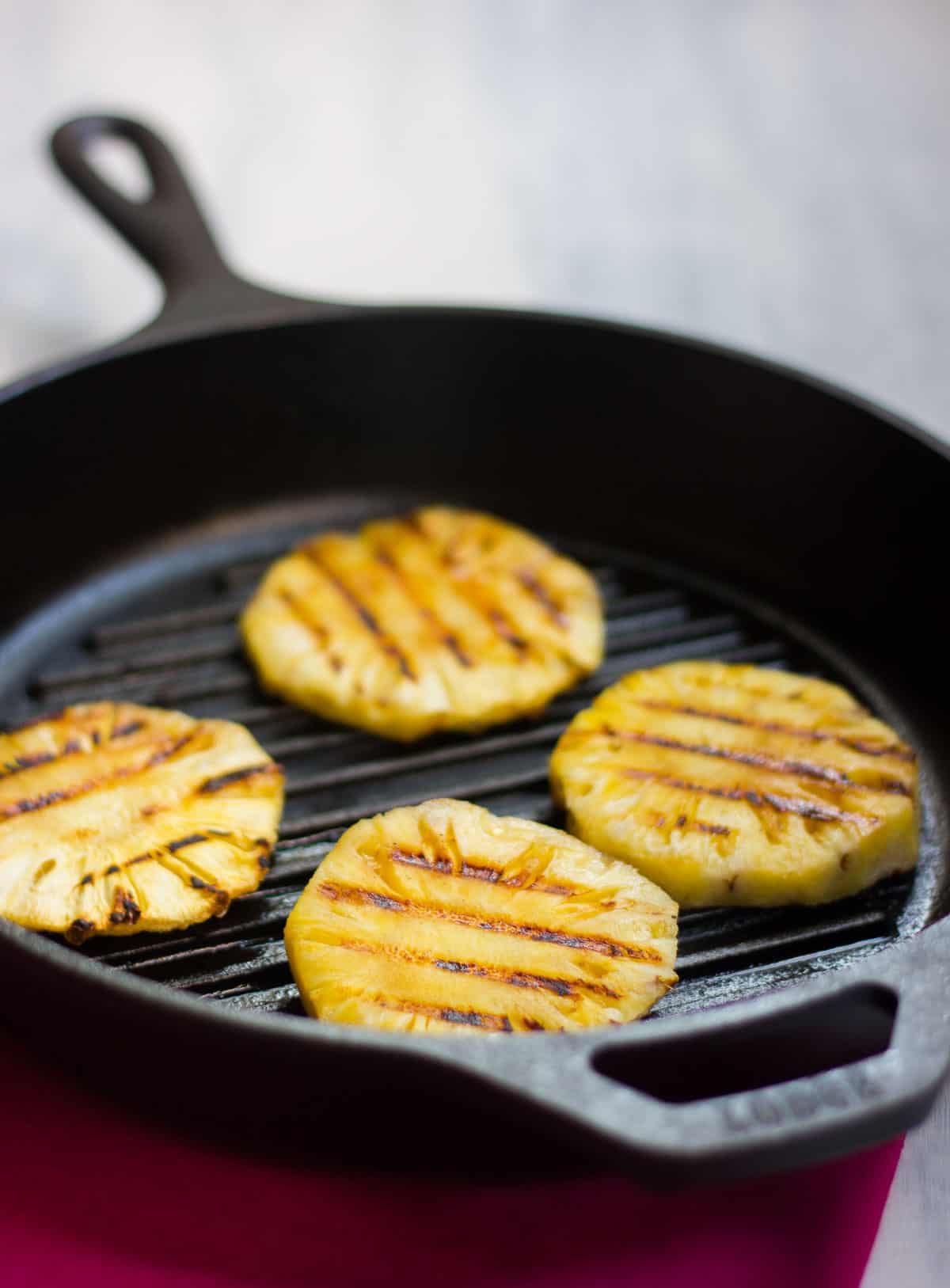 Pineapple being grilled for the Spicy Grilled Pineapple Salsa