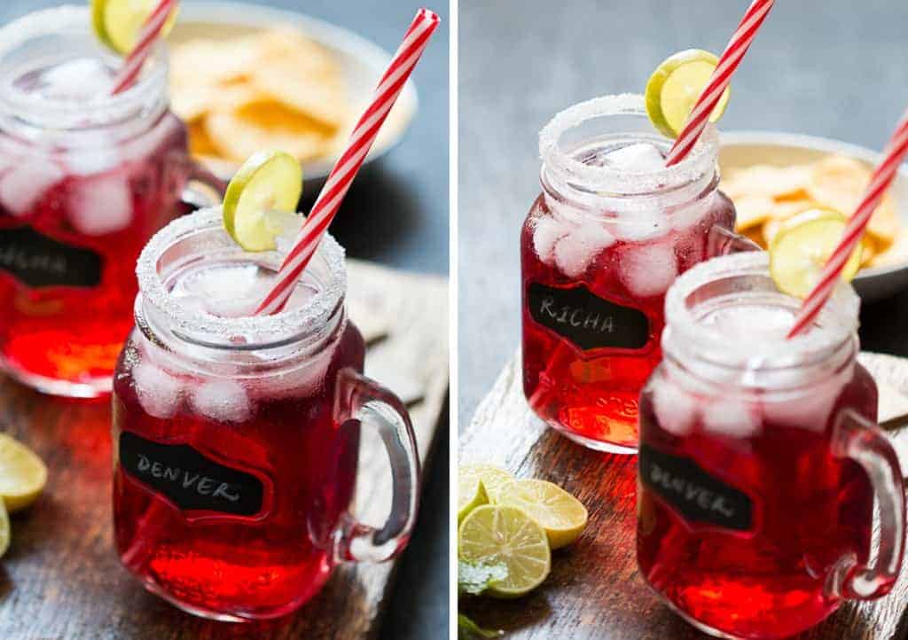 Cranberry Ginger Holiday Cocktail served in mason jars with sugar coated rims and a slice of lime.