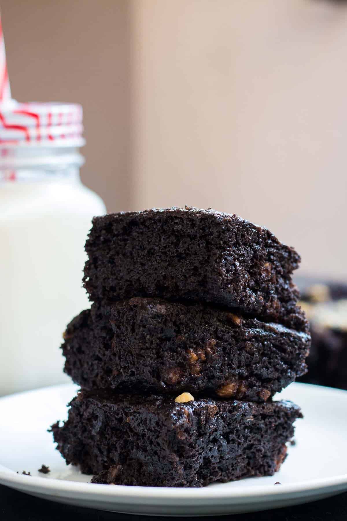 Eggless brownies served on a white plate.