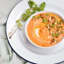 The dip garnished with pumpkin seeds