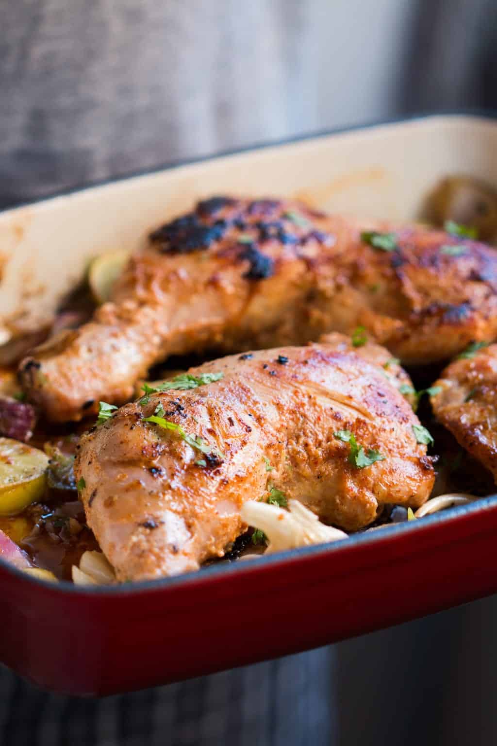 sumac chicken in a red pan