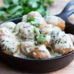 The Creamiest No Mayo Parsley Baby Potatoes in a black skillet.
