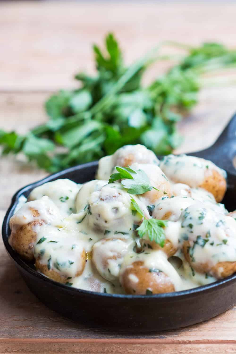 creamy no mayo parsley baby potatoes in a skillet