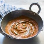 The curry base in a large pan/ kadhai.