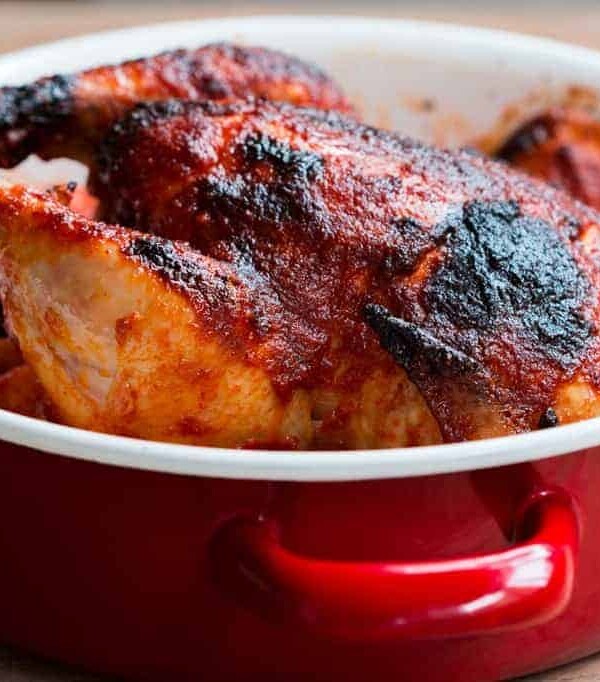 The Indian Style Whole Masala Roast Chicken in a red Fujihoro casserole.