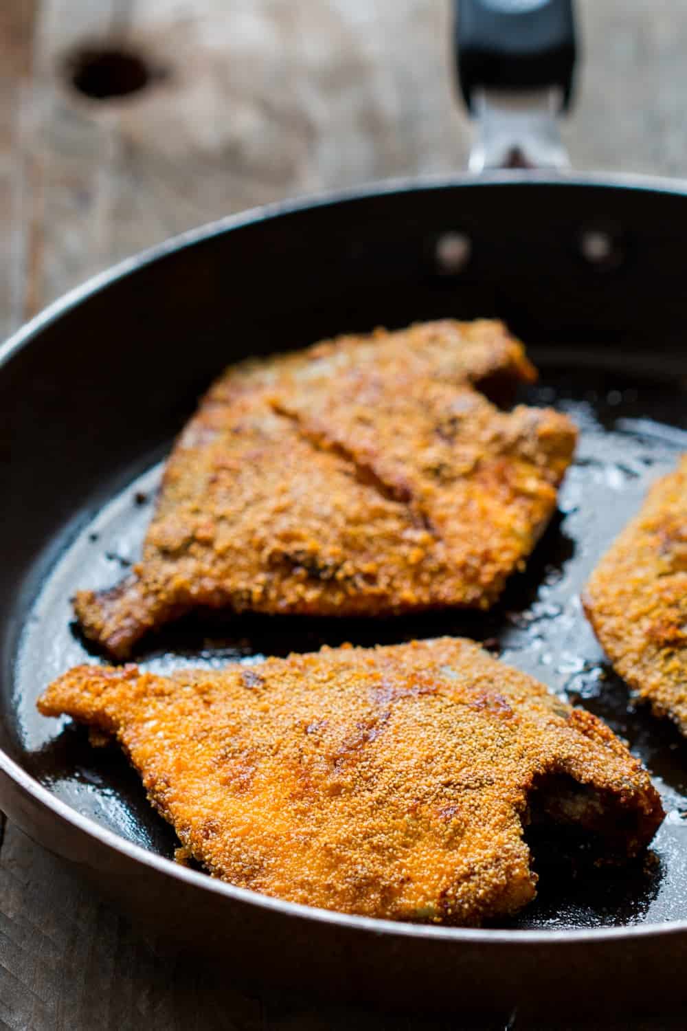 the fried fish coated with rava aka semolina in a pan