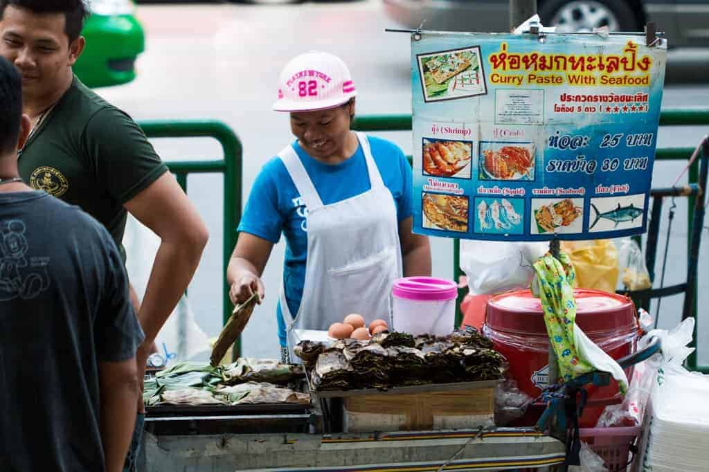 A person cooking their street food