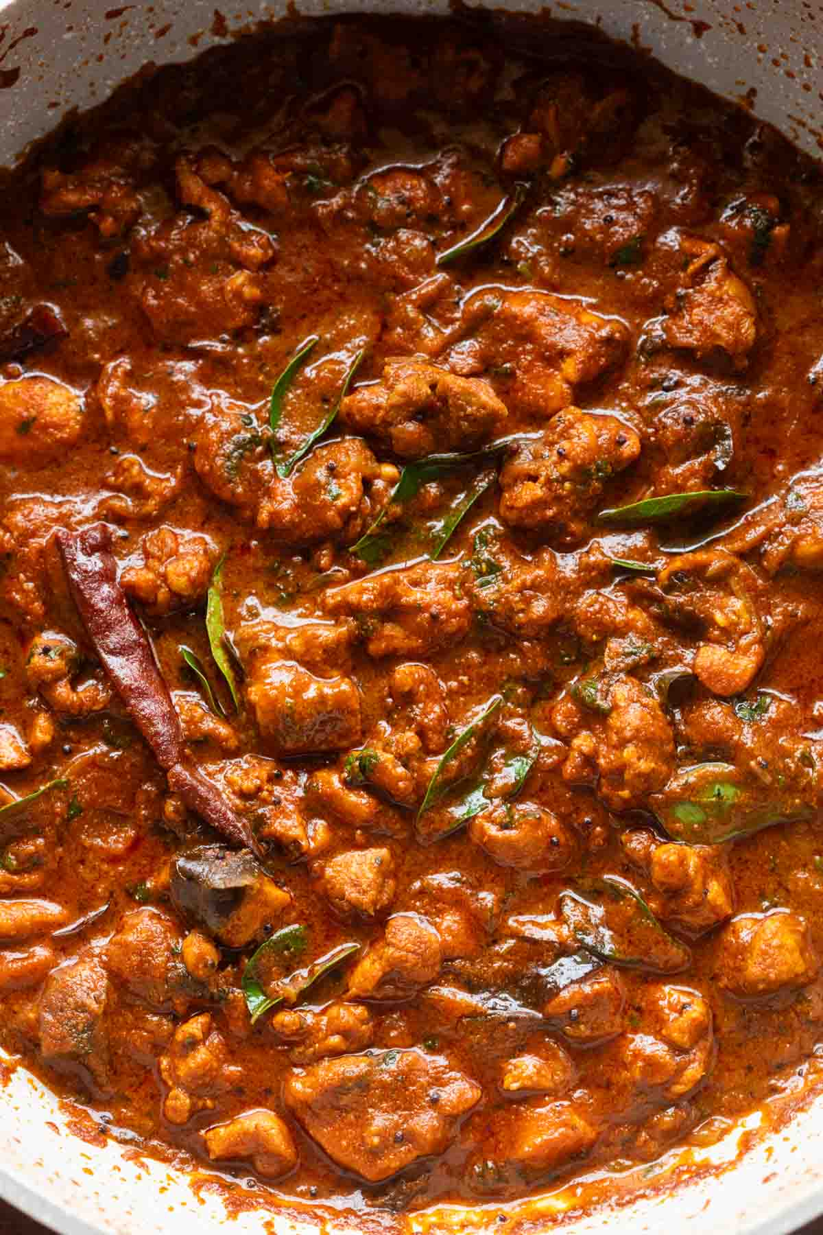 chettinad chicken curry in a white pan ready to be served