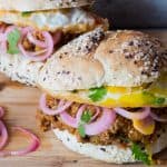The Keema Pav Burger/ Indian Lamb Sloppy Joes served on a wooden board.