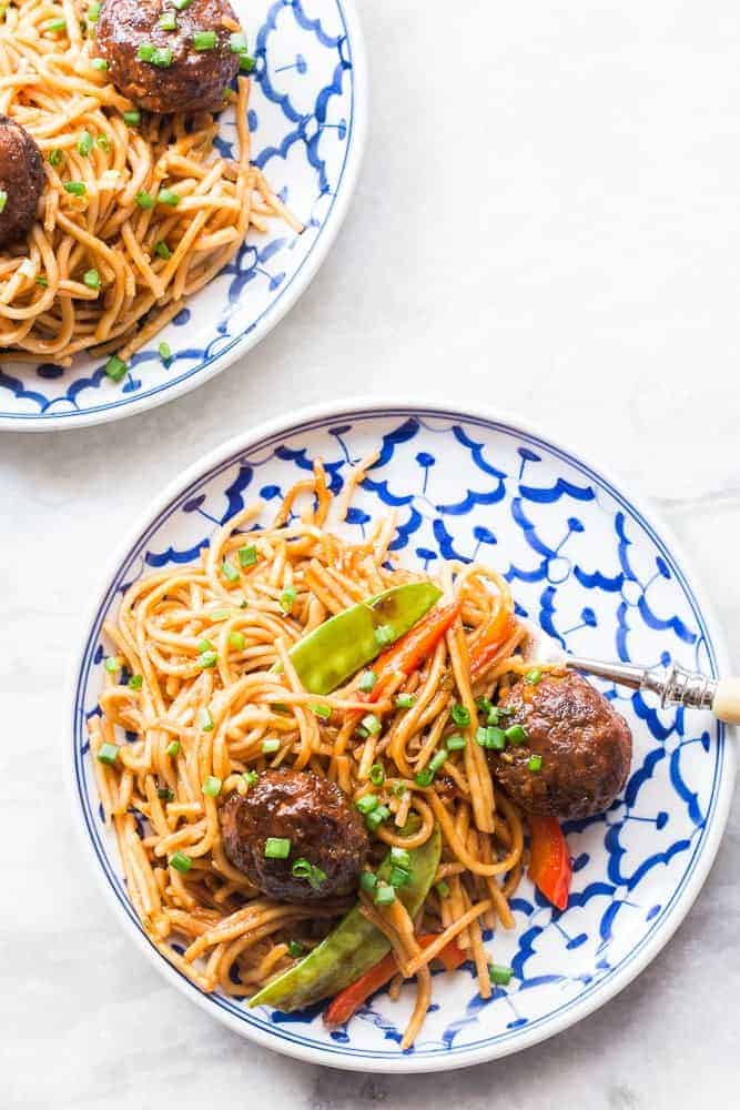 one pan veg noodle and manchurian stir fry served in a plate