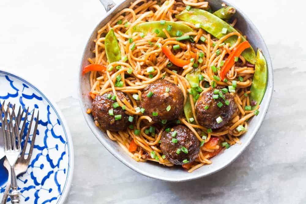 one pan veg noodle and manchurian stir fry served in a pan