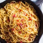 The spaghetti in a cast iron pan.
