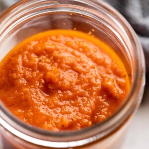 Cooked pasta sauce in a jar ready to be stored
