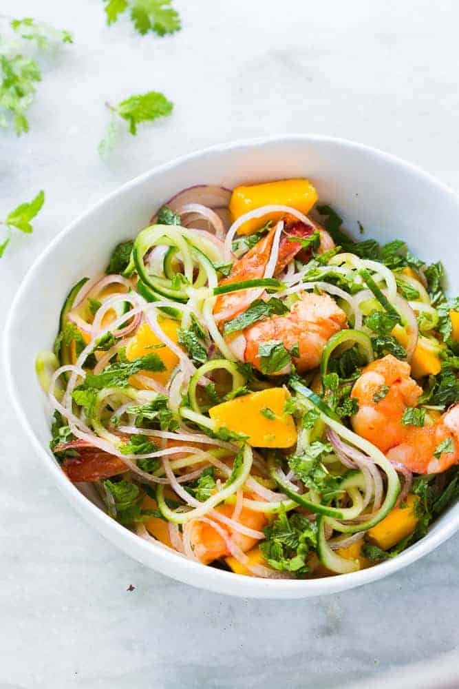 cucumber noodle prawn and mango salad served in a bowl