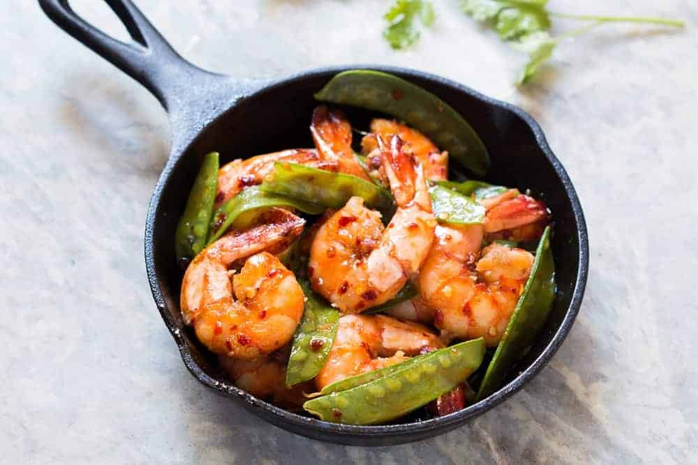 honey garlic shrimp in a cast iron pan
