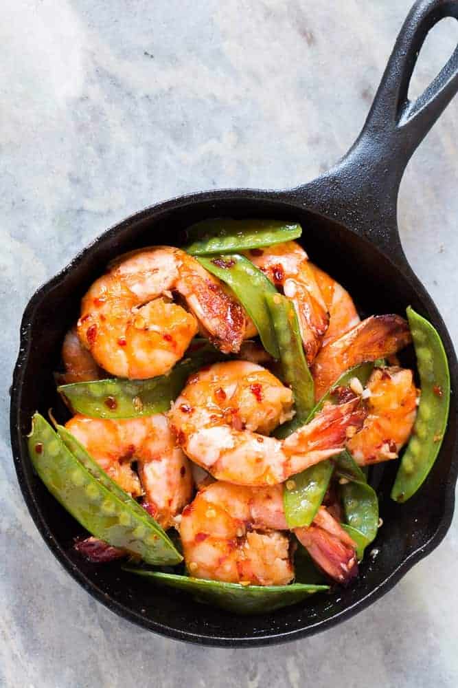 5 Ingredient Honey Chilli Garlic Tiger Prawns Looking for meals that take under 15 minutes? This is it - 5 ingredient honey garlic chilli jumbo tiger prawns! All the asian flavours you love in this one easy recipe! You can use shrimp, prawns or scampi and add whatever veggie you like - broccoli, bok choy, beans or even spinach! Soy free, gluten free, probably Whole30, Paleo and nut free!