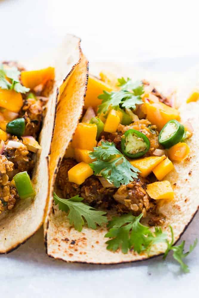 Healthy Oats Crusted Fish Tacos + Mango Salsa This recipe for super easy, healthy oats crusted fish tacos takes ONLY 15 mins from start to finish. Use cod, tilapia, red snapper or any other white fish. Instead of the usual cabbage slaw, I topped these with cilantro mango salsa for extra zing! Perfect for your next dinner/barbecue this summer!