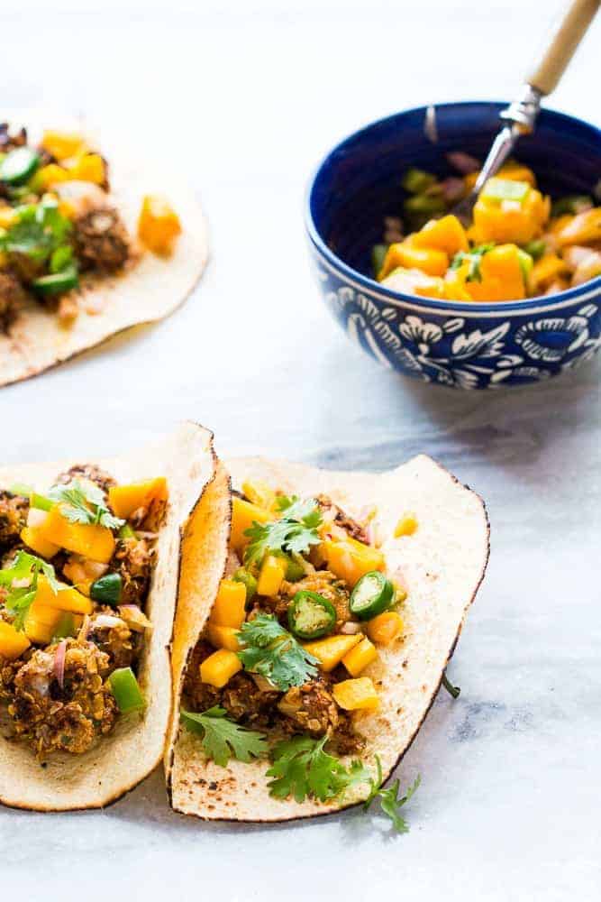 Healthy Oats Crusted Fish Tacos + Mango Salsa This recipe for super easy, healthy oats crusted fish tacos takes ONLY 15 mins from start to finish. Use cod, tilapia, red snapper or any other white fish. Instead of the usual cabbage slaw, I topped these with cilantro mango salsa for extra zing! Perfect for your next dinner/barbecue this summer!