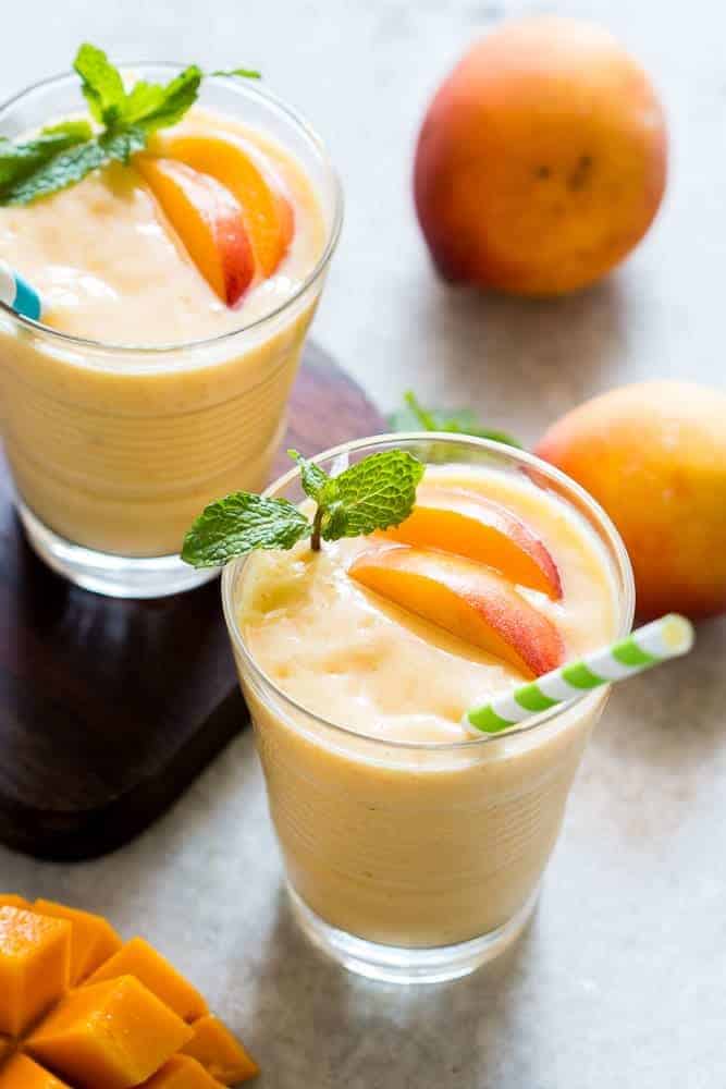 Healthy Vegan Frozen Peach Mango Smoothie This healthy peach mango smoothie is vegan and the frozen fruit makes it thick and dessert like! Also get my top tips for making the best smoothies!
