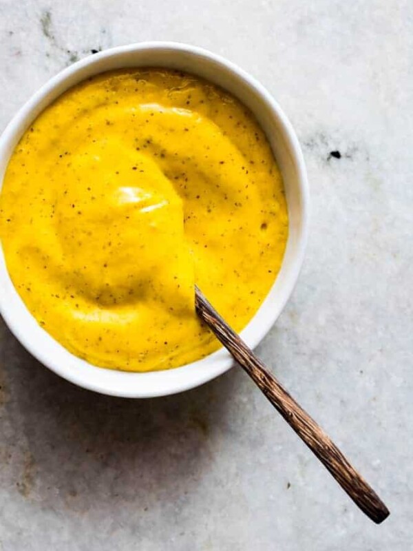 The Blender Mango Mustard Dipping Sauce in a white bowl.
