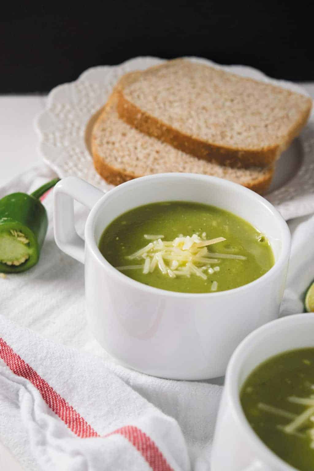 pressure cooker zucchini basil soup served in white cups