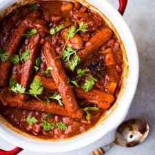 One Pot Curried Sausages and Potatoes garnished with coriander.