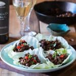 Stir fried black bean chicken lettuce cups served with Big Banyan's Sauvignon Blanc wine!