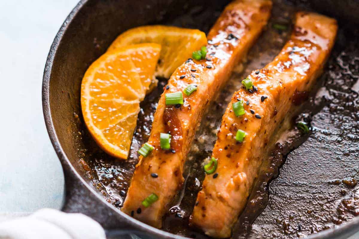 Pan seared orange mustard salmon - easy, healthy, 15 minute dinner with a sticky marinade. Clean eating ingredients, serve with pasta, or cauliflower rice