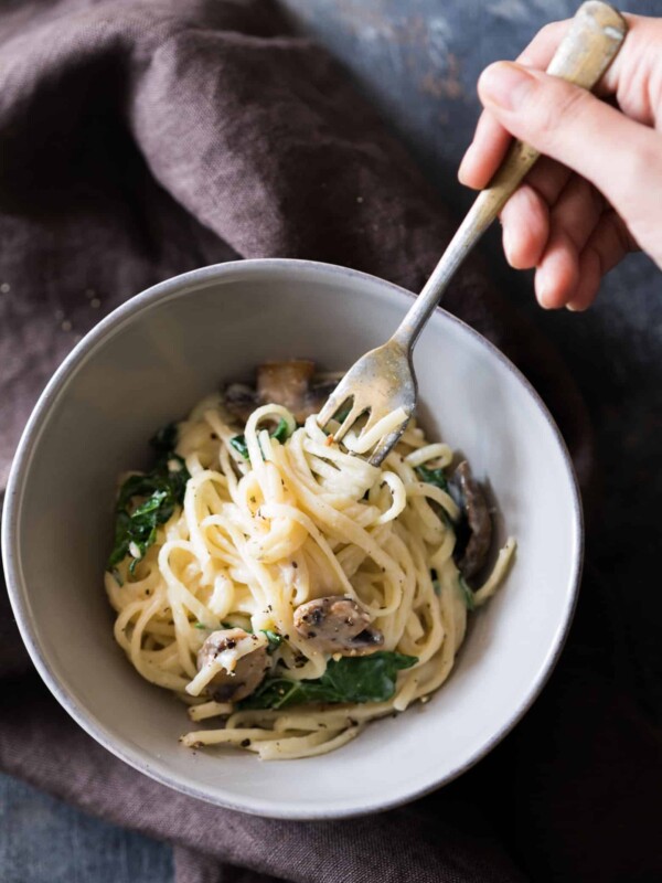 Creamy Lemon Mushroom Kale Linguine Pasta served in a grey bowl.