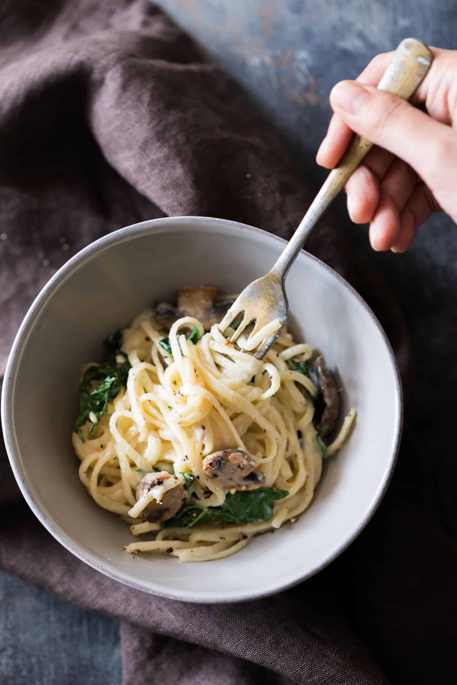 Creamy lemon mushroom kale linguine pasta is vegetarian, ready in 30 minutes with the best healthy alfredo style white sauce you'll make!