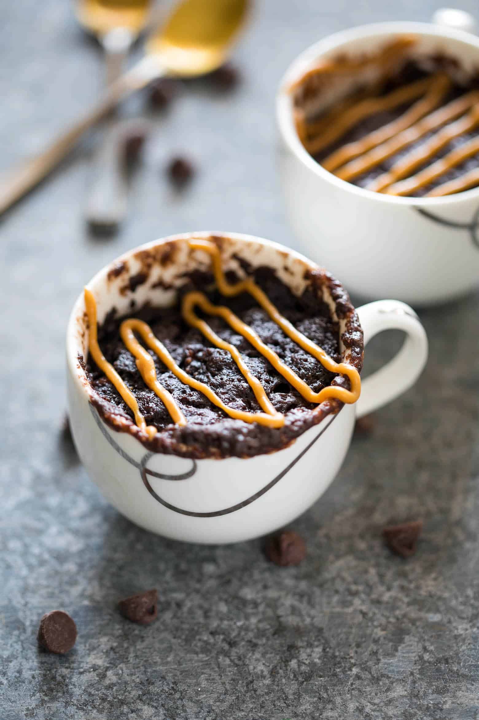 Single serving eggless banana chocolate peanut butter mug cake is the best, gooey and the moistest mug cake recipe you'll try. Ready in under 5 minutes and just needs a microwave!