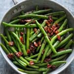 Sauteed Brown Sugar Bacon Garlic Green Beans in a pan.