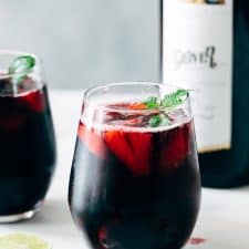 Summer Berry Red Wine Spritzer served with mint in glasses.