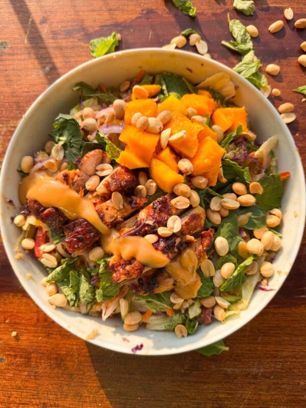 an image of thai mango quinoa salad served in a bowl