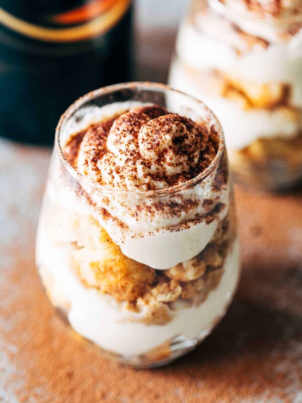 Baileys Tiramisu seasoned with coffee powder and served in a glass.