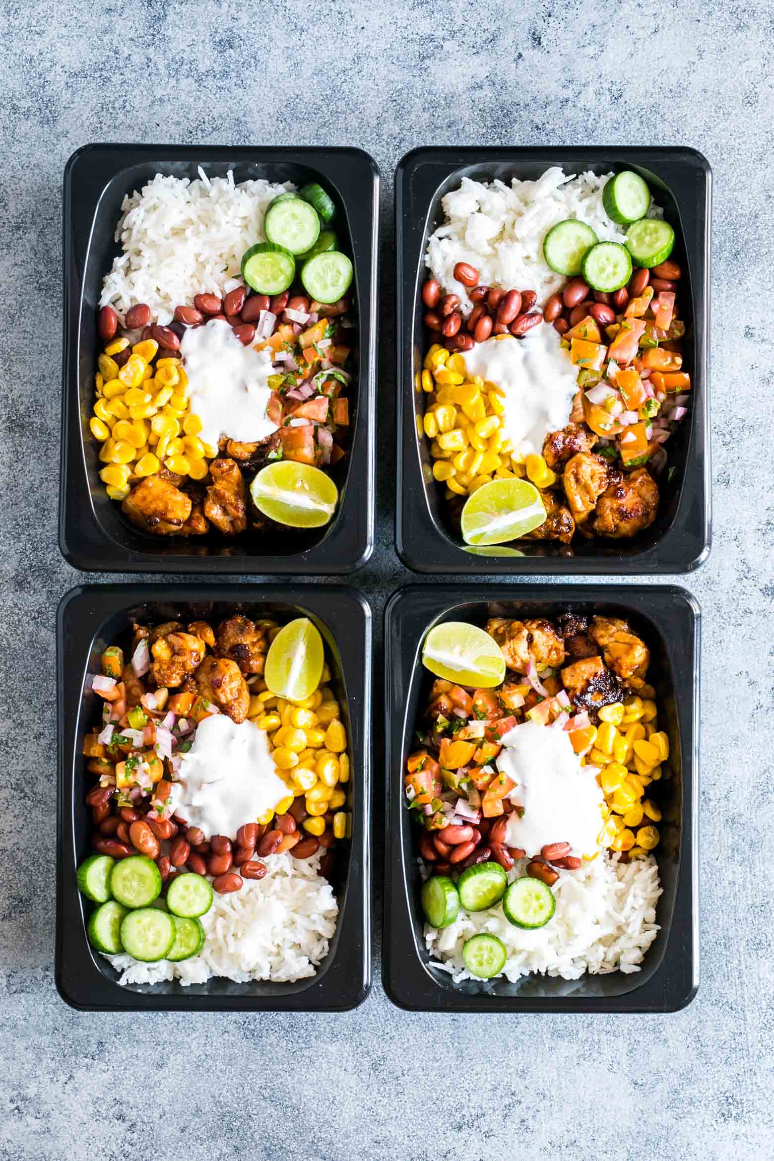 Easy chicken burrito meal prep bowls are perfect for planning weekday work lunches ahead! They are super tasty, gluten free and a healthy way to make sure you have home cooked lunch boxes ready to go.