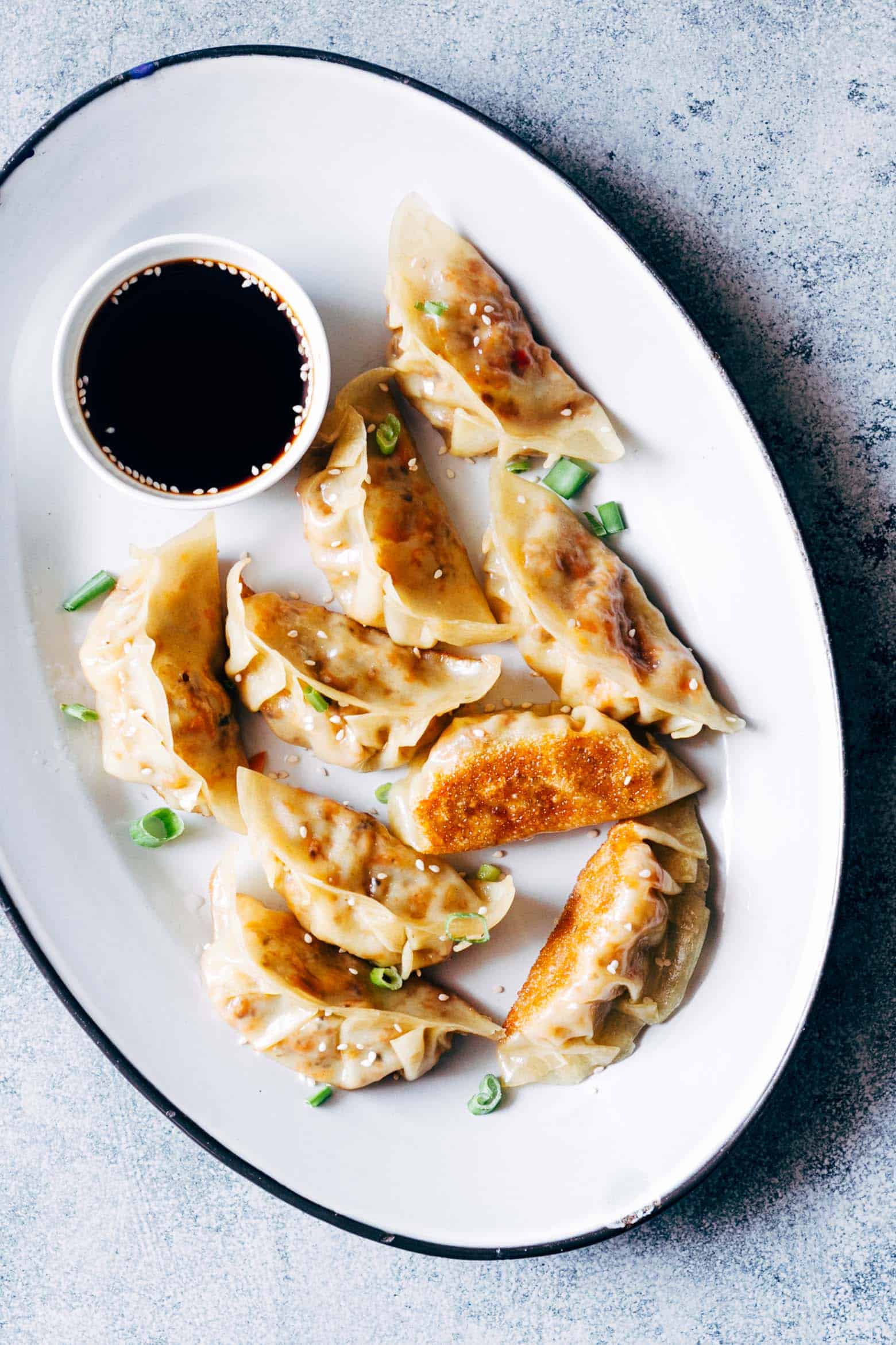 These vegetarian gyoza potstickers are stuffed with a delicious mixture of carrot, shiitake mushrooms and paneer and are insanely ease to make! Don't be intimidated because I have step by step instructions for you to make them at home.