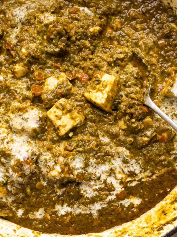Picture of saag paneer in the pan that it was cooked in with a spoon