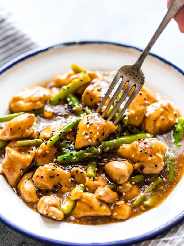 Lemon Ginger Chicken Asparagus Stir Fry served on a white plate.