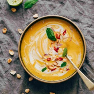 This Thai Butternut Squash Sweet Potato Bisque is perfect for cold winter days - super thick and creamy soup with a hint of heat that will keep you warm and cozy. It has all the fall flavours and ingredients - onions, carrots, butternut squash, sweet potato, thai curry paste and coconut milk.