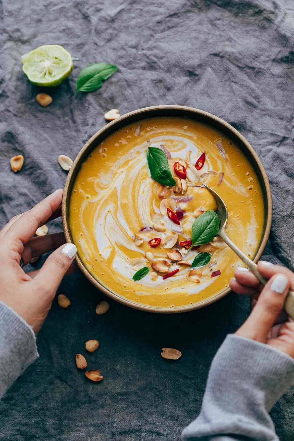 This Thai Butternut Squash Sweet Potato Bisque is perfect for cold winter days - super thick and creamy soup with a hint of heat that will keep you warm and cozy. It has all the fall flavours and ingredients - onions, carrots, butternut squash, sweet potato, thai curry paste and coconut milk.