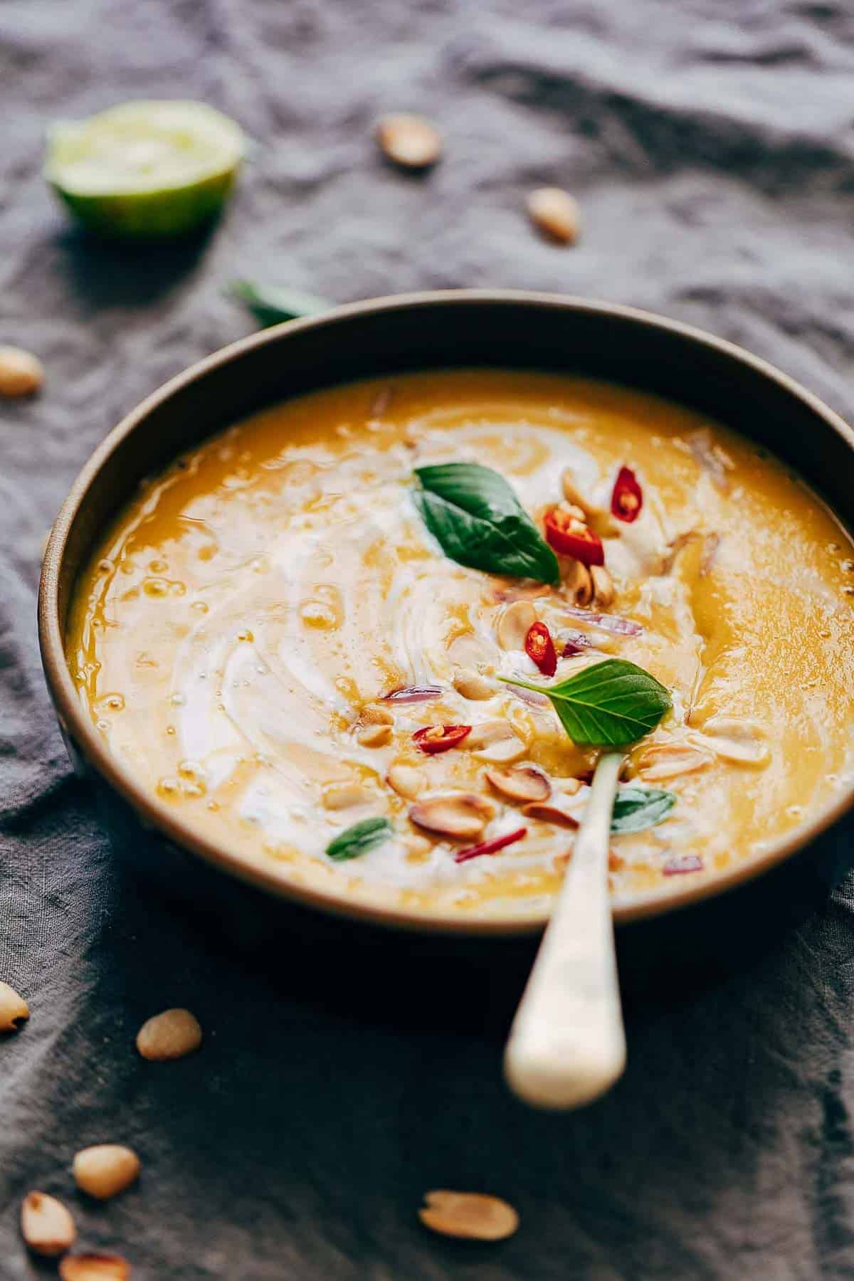 This Thai Butternut Squash Sweet Potato Bisque is perfect for cold winter days - super thick and creamy soup with a hint of heat that will keep you warm and cozy. It has all the fall flavours and ingredients - onions, carrots, butternut squash, sweet potato, thai curry paste and coconut milk.