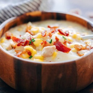 Instant Pot Chicken Potato Corn Chowder with Bacon served in a wooden bowl.
