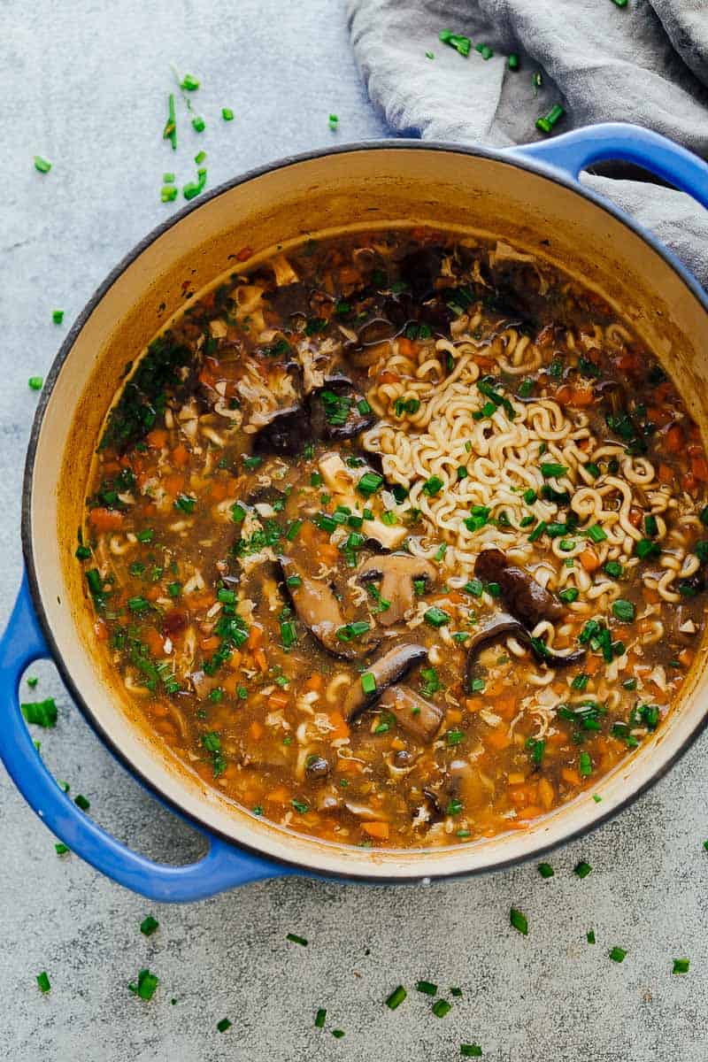 Pot full of chinese hot and sour soup with ramen