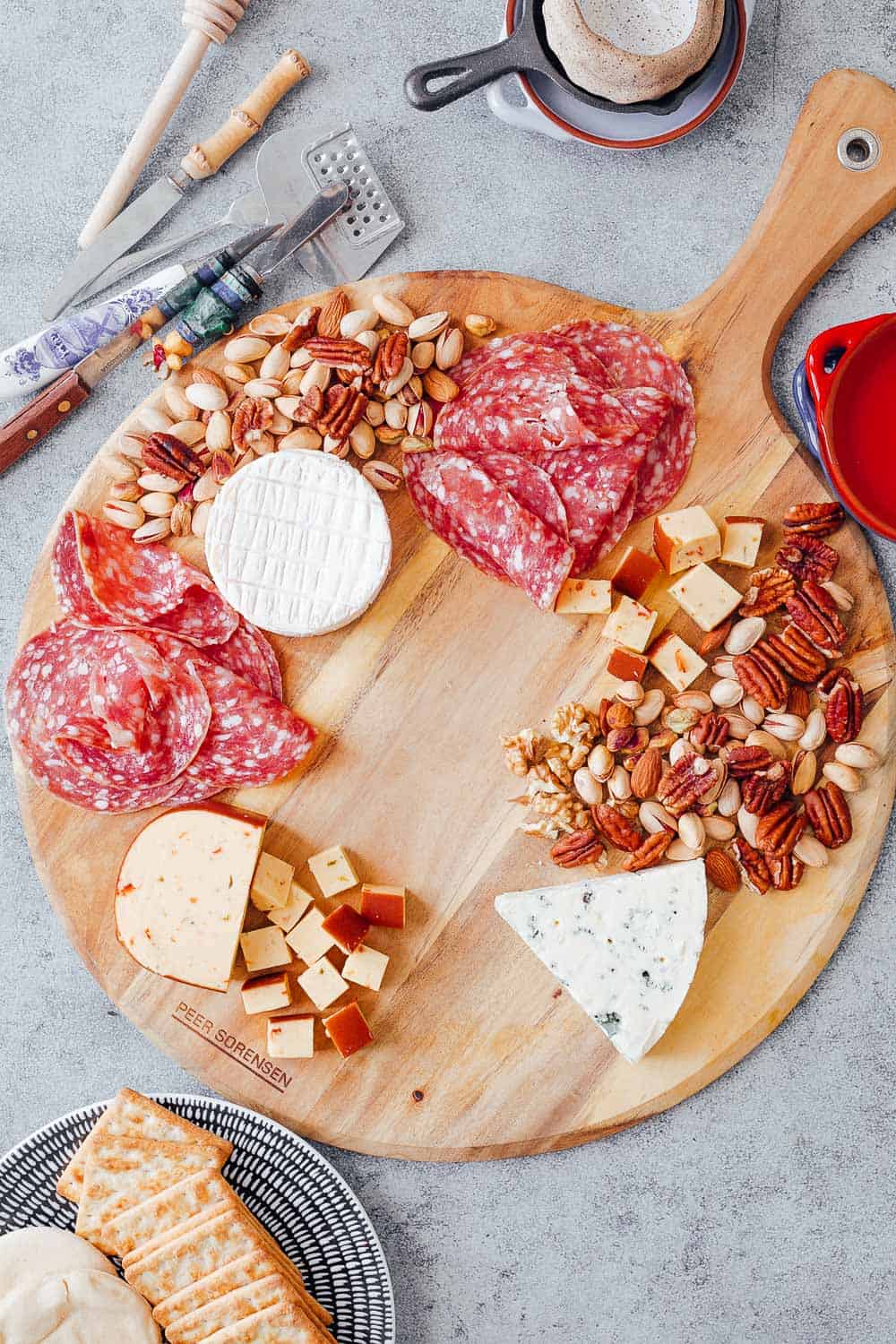 Step #3 to create the ultimate wine and cheese board on a budget is to choose cheap charcuterie for the board along with any nuts that you already have in your pantry. Salami is usually cheaper than more expensive cuts like parma ham