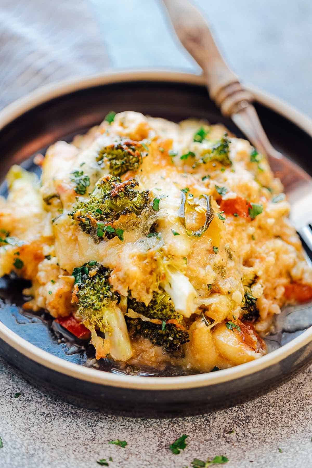 Healthy Cauliflower Rice Broccoli Casserole served on a plate with a fork