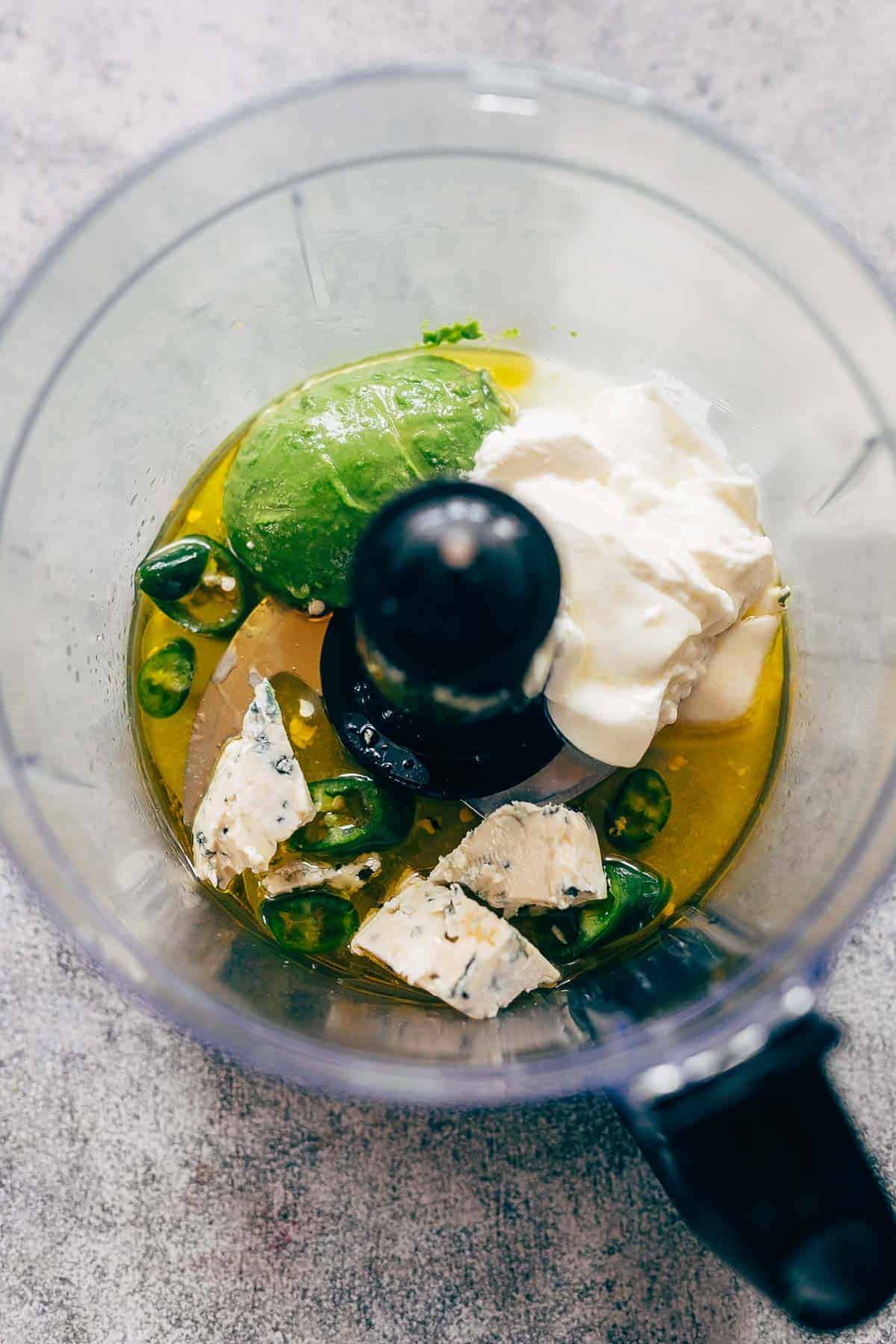 Creamy avocado blue cheese salad dressing is the best homemade blue cheese dressing you'll try - its lighter because it's yogurt based and has a sharp taste that's perfect when drizzled on your favourite cobb salad. You can use this dressing to a pasta salad or even use it as a dip! creamy avocado blue cheese dressing ingredients in a blender