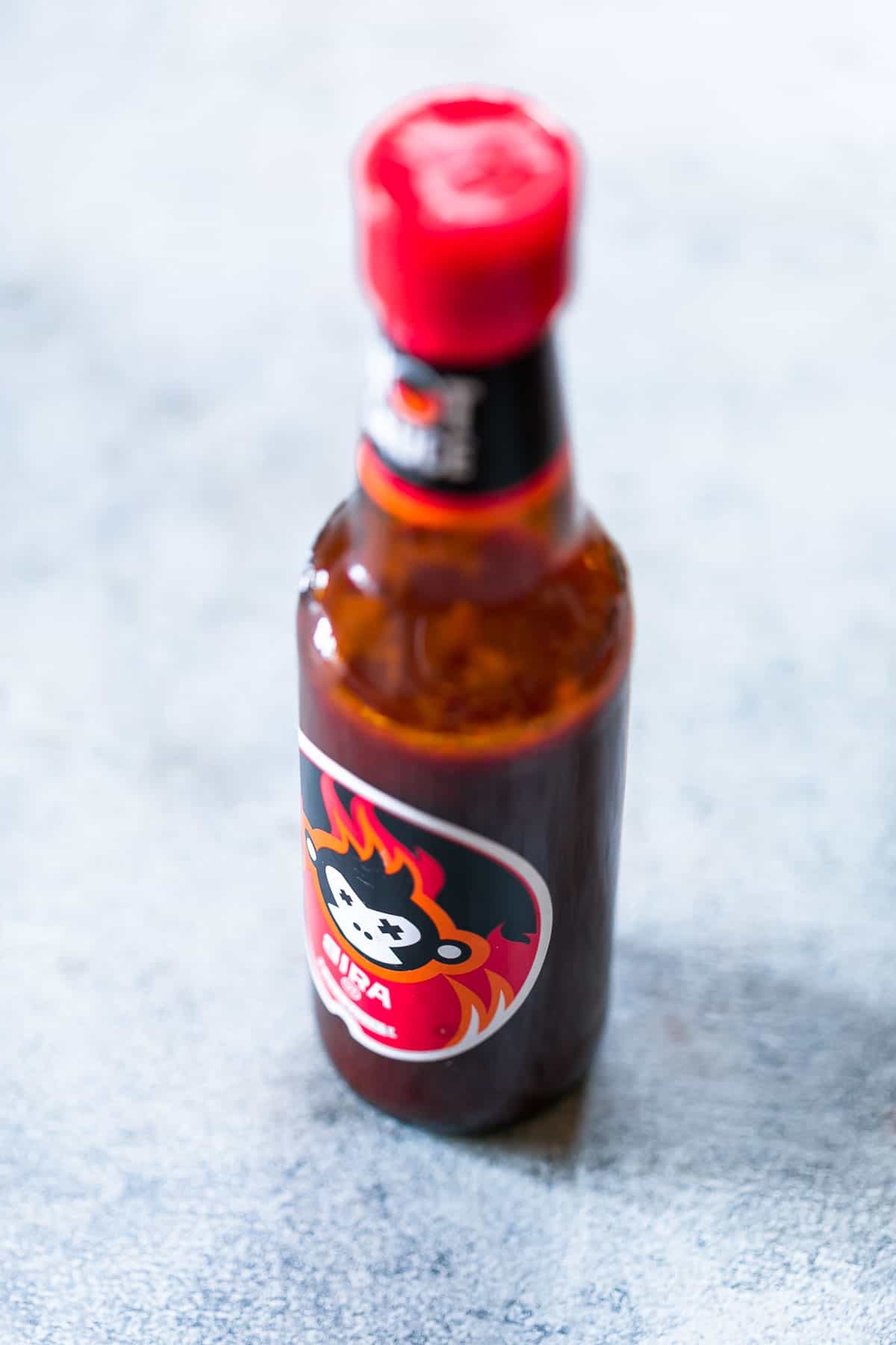 If you think regular deviled eggs are great, these spicy bacon deviled eggs are the bomb! They have a kick from the heat, and smokiness from the bacon and are really fast to put together. #eggs #brunch #easter #spring #recipes #appetizer #snack Bira's hot sauce