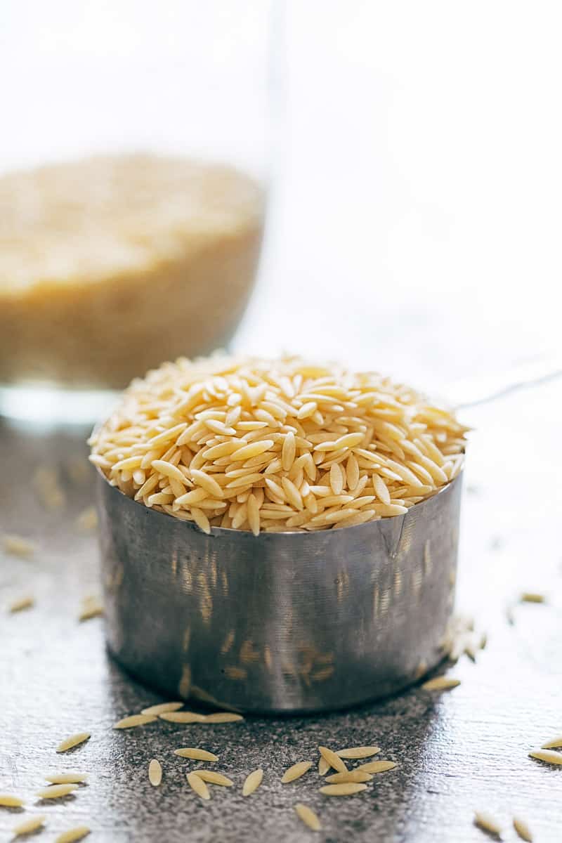 Orzo pasta in a measuring cup