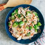 Creamy Apple Broccoli Walnut Salad served in a blue bowl.